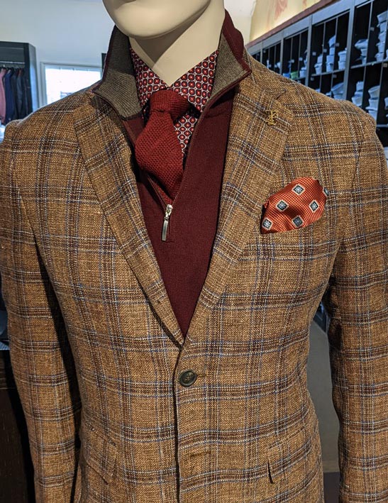 Fall colurs in mens suit-plaid and rust pullover with matching tie