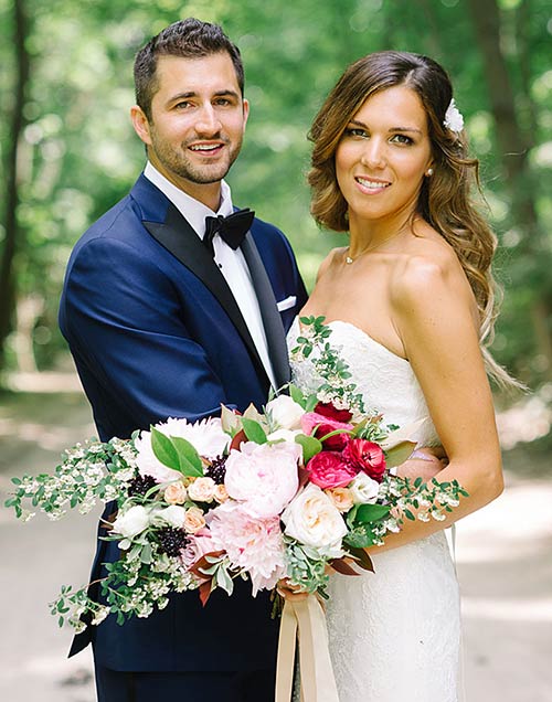 A beautiful blue tuxedo conveys sophistication with a black bowtie, matching the black lapel. wedding-groom and bride
