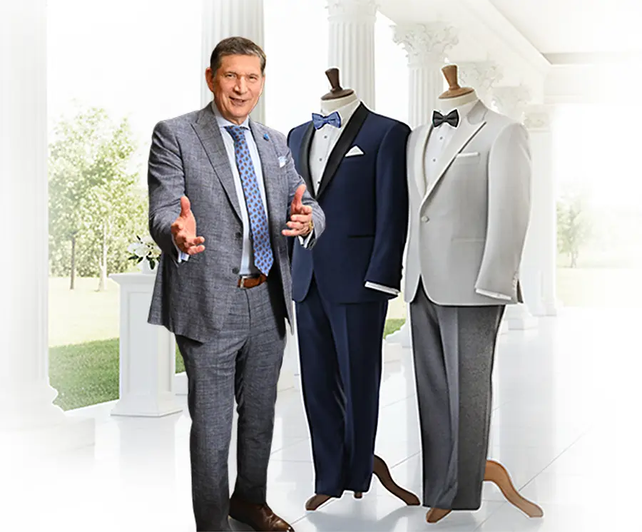 tom showing 2 tuxedos in a wedding venue