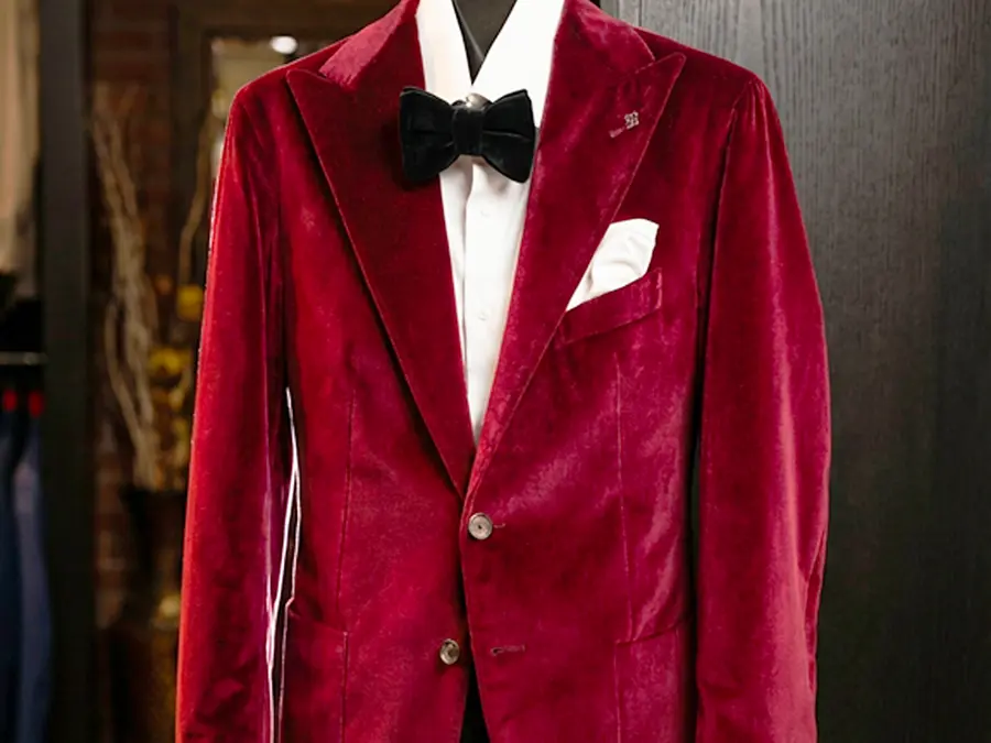 A red velvet tux will always turn heads, and favour the bold. Black or dark grey accessories pair perfectly, and match your partner with any colour in the bowtie. red-tuxedo