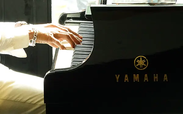 Yamaha Yamaha piano being played close up
